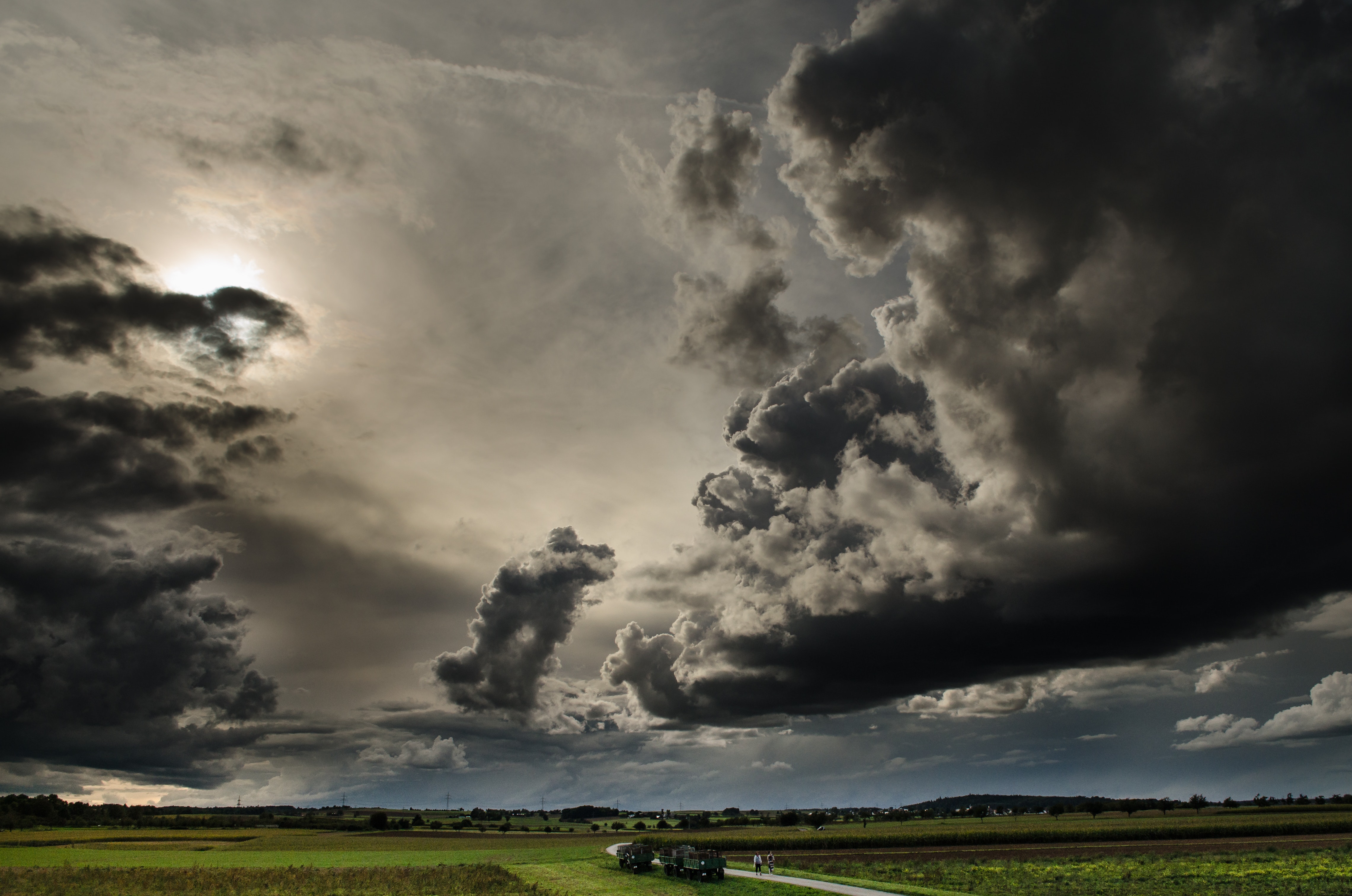 Dramatic Field Under Dark Clouds Wallpapers