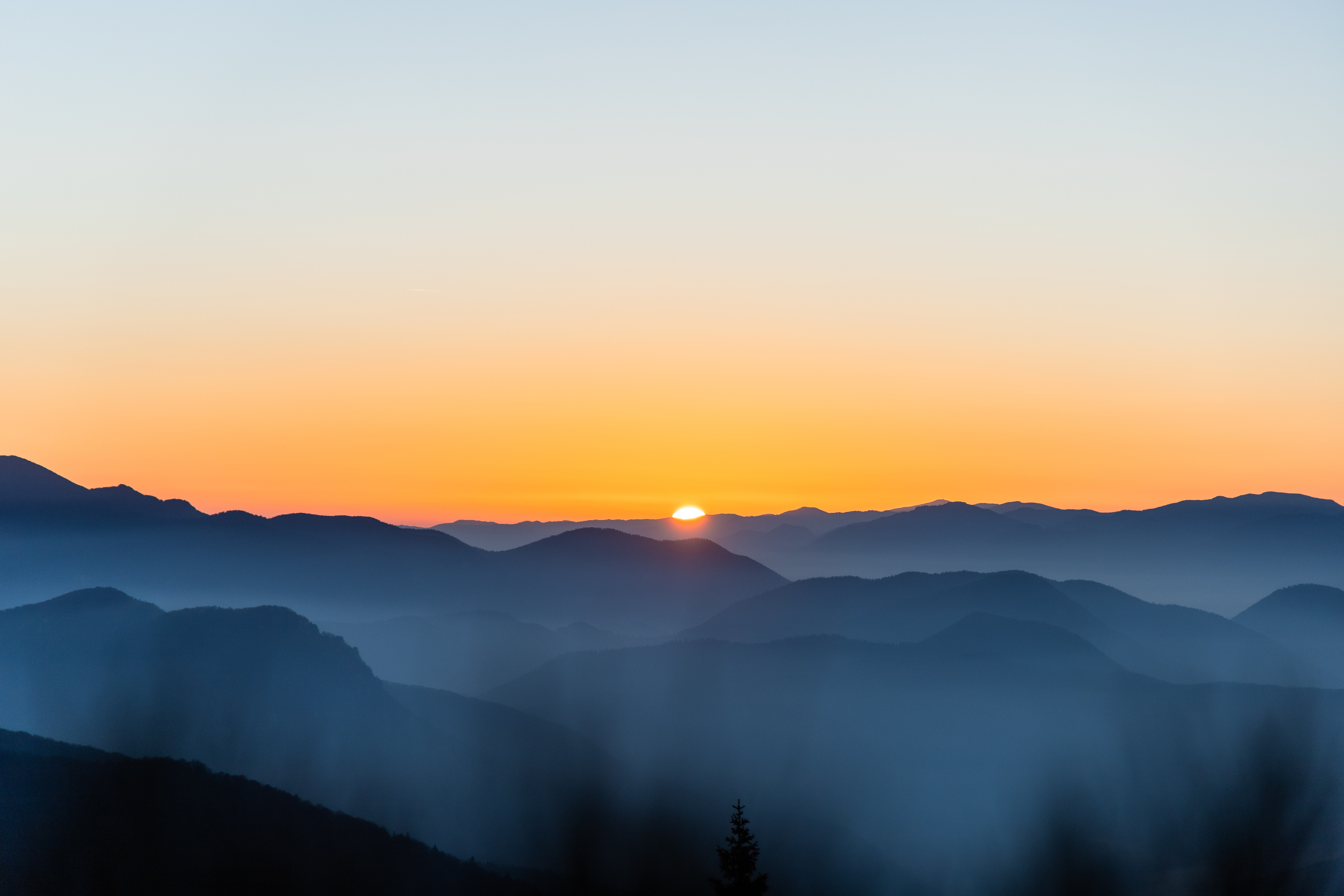 Green Grass And Fogg Under Purple Sky During Sunset Wallpapers