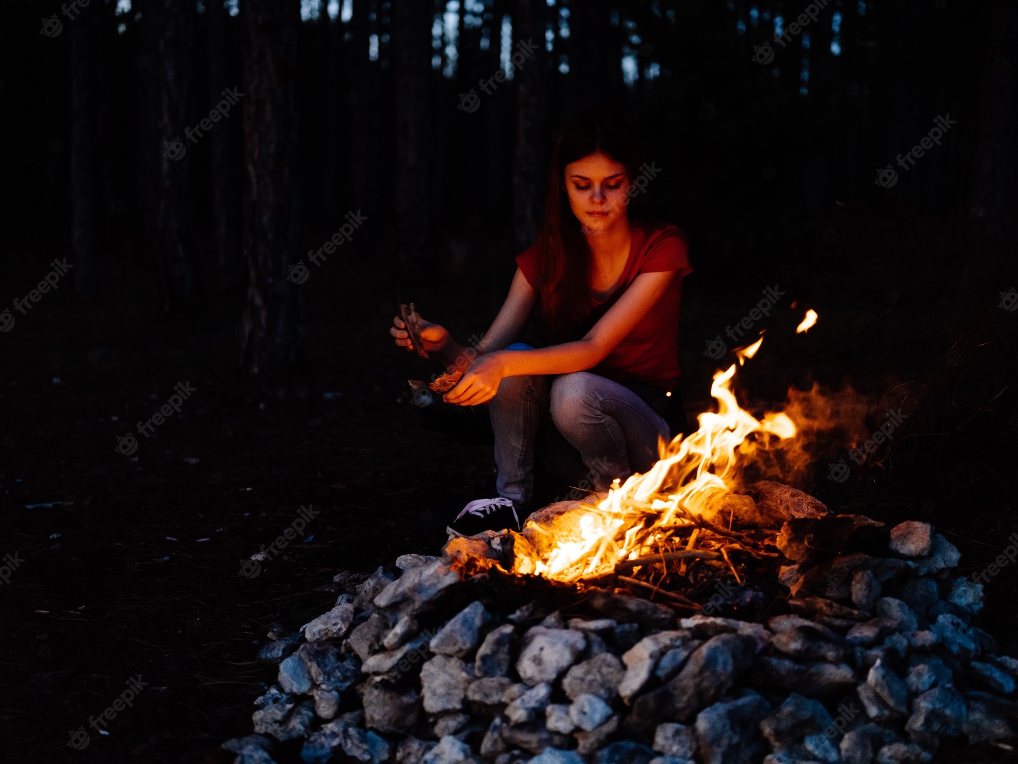 People Sitting Around Campfire In Dark Night Wallpapers