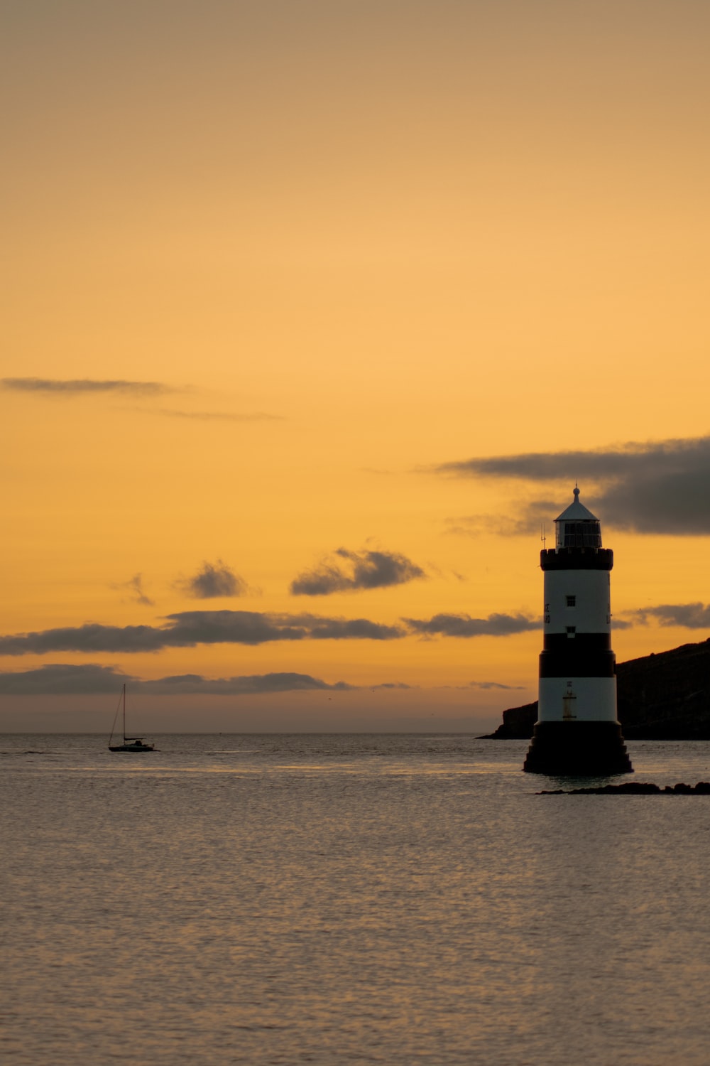 Yellow Sunset Near Lighthouse Wallpapers