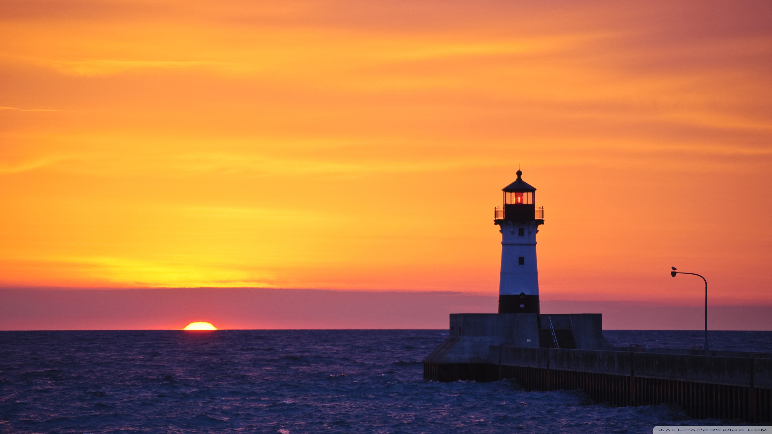 Yellow Sunset Near Lighthouse Wallpapers