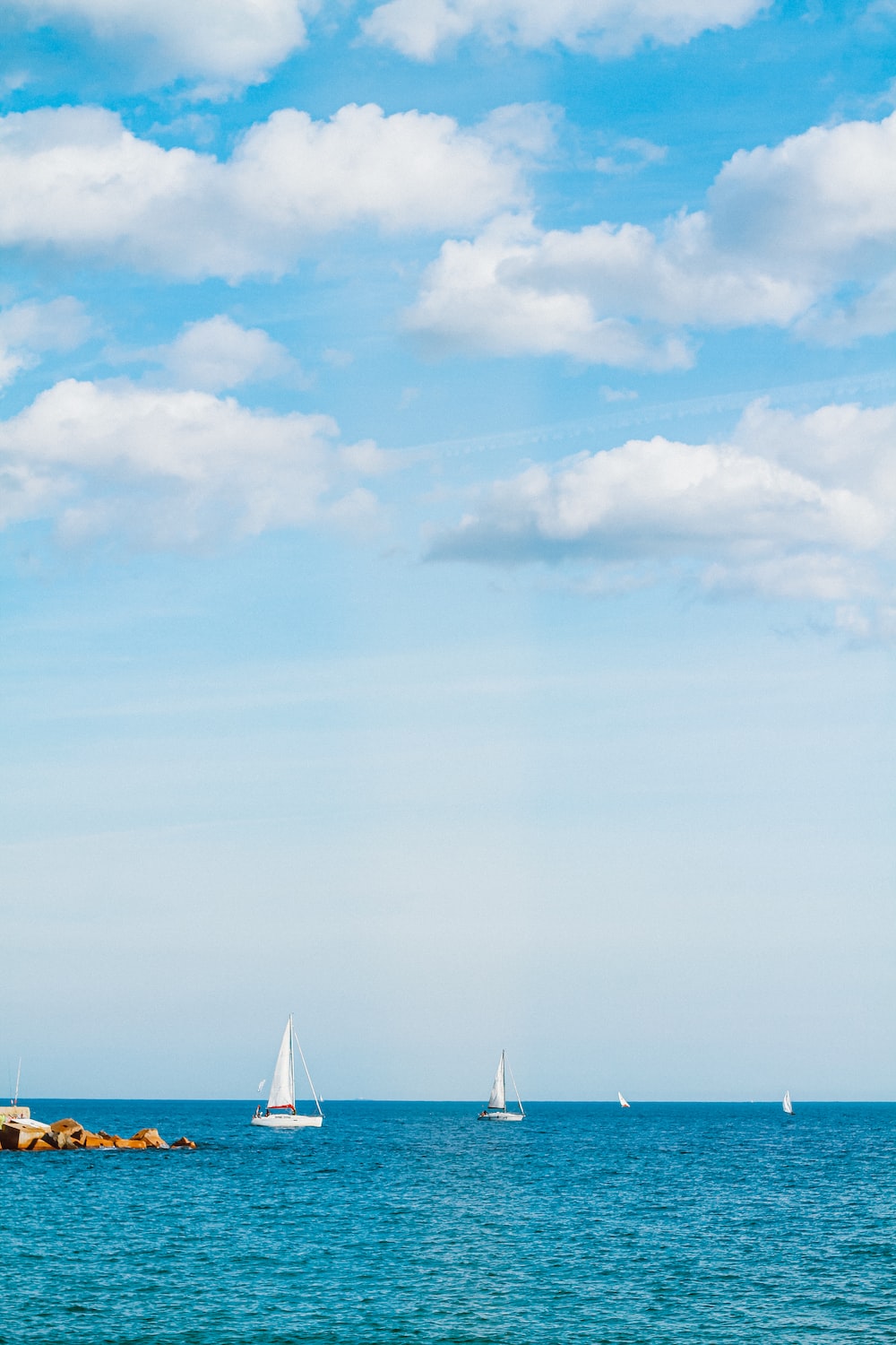 Boat In Blue Sea Water Wallpapers