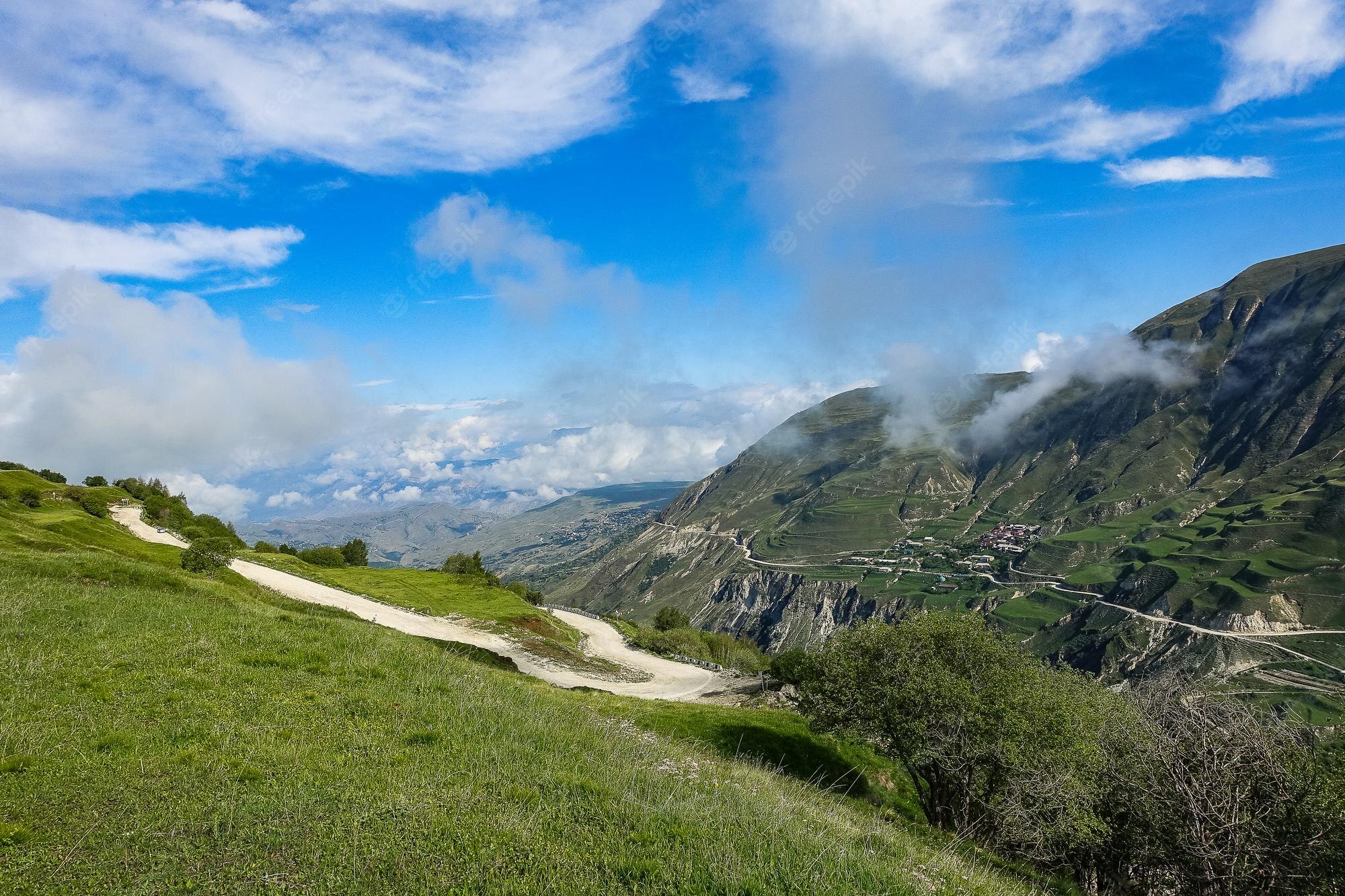 Road With Background Of Mountains And Clouds